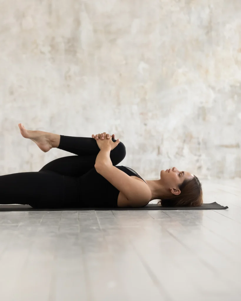 Woman lying calmly on a mat with eyes closed during a body-based TRE® session in Pretoria East